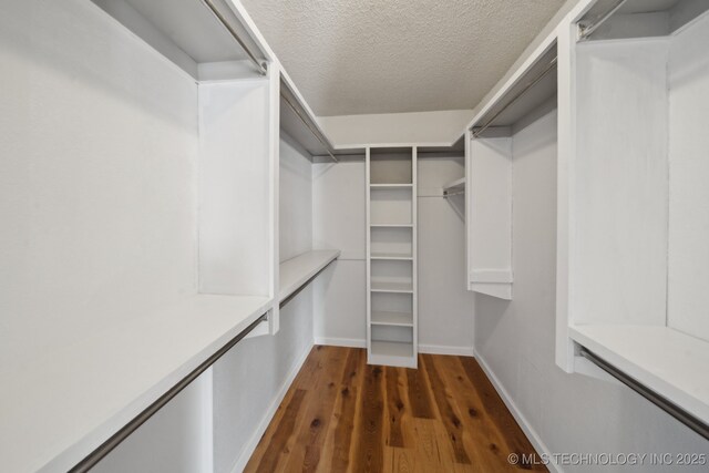9435 S 33rd W Ave, Tulsa, OK 74132 - walk in closet featuring dark wood-style floors