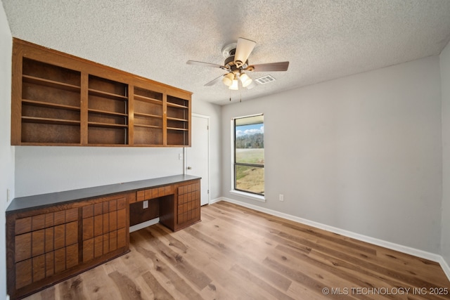 9435 S 33rd W Ave, Tulsa, OK 74132 - unfurnished office with built in study area, a ceiling fan, a textured ceiling, light wood-style flooring, and baseboards