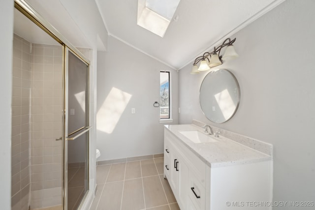 full bath with lofted ceiling with skylight, a shower stall, tile patterned floors, and vanity