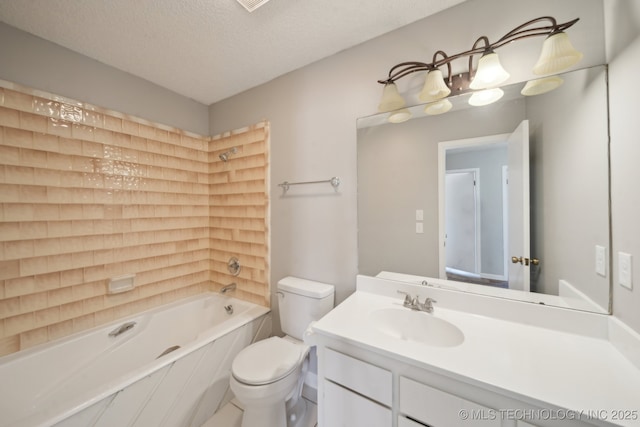 bathroom with toilet, washtub / shower combination, a textured ceiling, and vanity