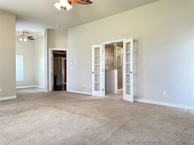 unfurnished bedroom featuring a ceiling fan, carpet, french doors, and baseboards