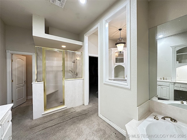 full bathroom featuring a bath, vanity, a shower stall, and visible vents