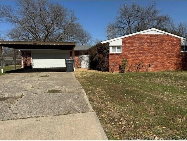 view of front facade with brick siding, a garage, driveway, and a yard