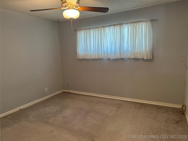 spare room featuring carpet, baseboards, ceiling fan, and a textured ceiling