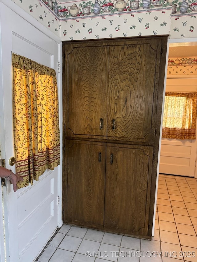 interior details featuring wallpapered walls