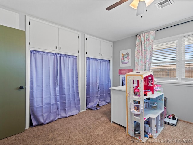 bedroom featuring carpet, visible vents, and ceiling fan