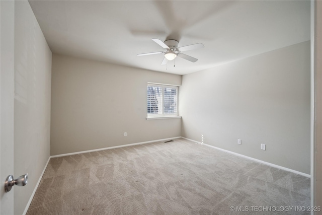 unfurnished room with baseboards, carpet floors, and ceiling fan