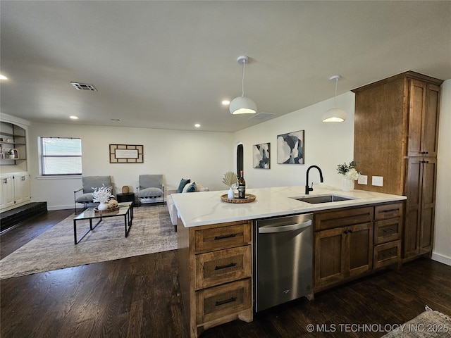 kitchen with a peninsula, a sink, dark wood-type flooring, dishwasher, and open floor plan