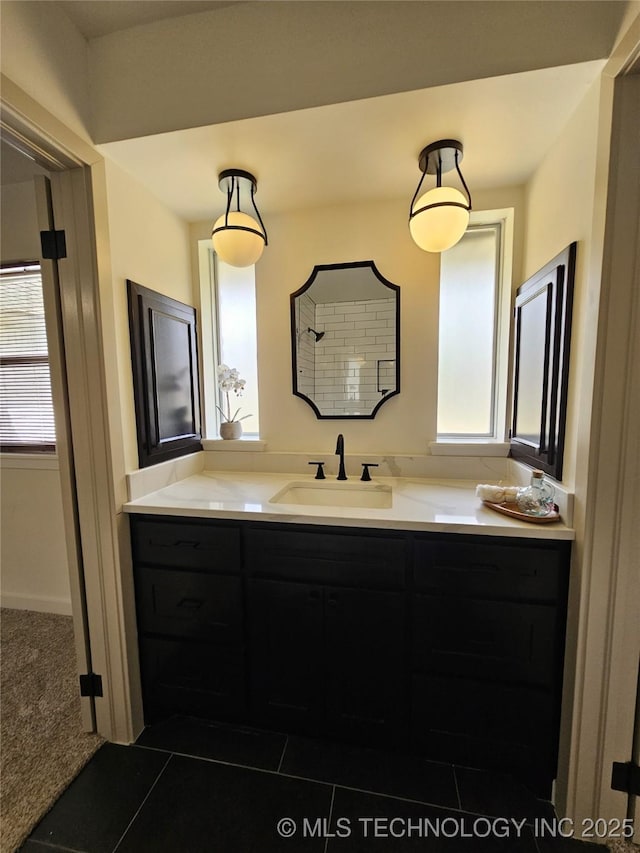 full bath with a shower, plenty of natural light, and vanity