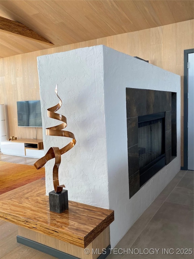 interior details with wood ceiling and a fireplace