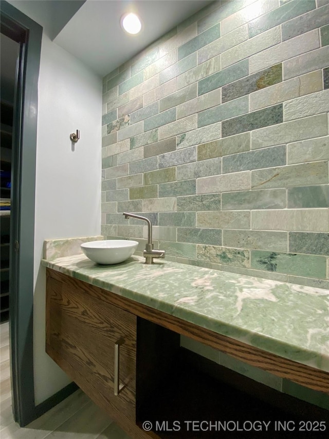 bathroom featuring recessed lighting and vanity