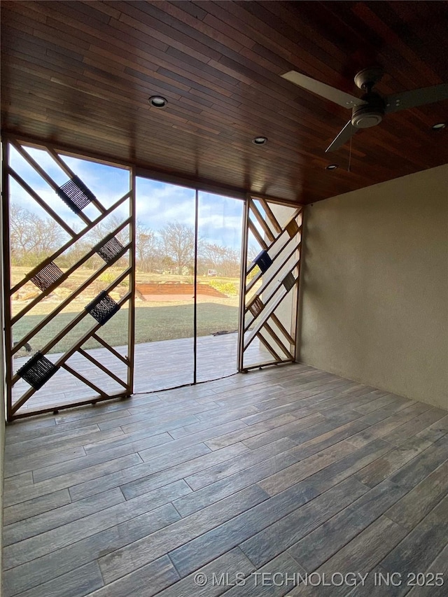 interior space with wooden ceiling and wood finished floors