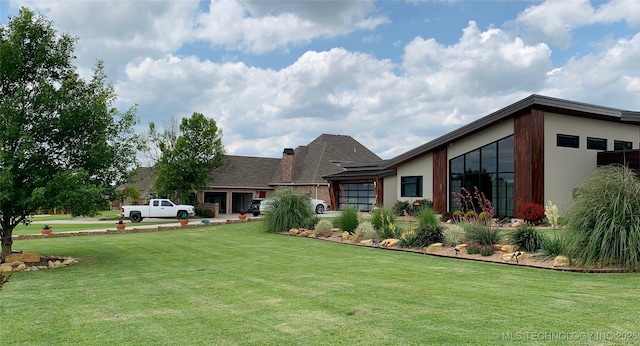 view of yard featuring an attached garage