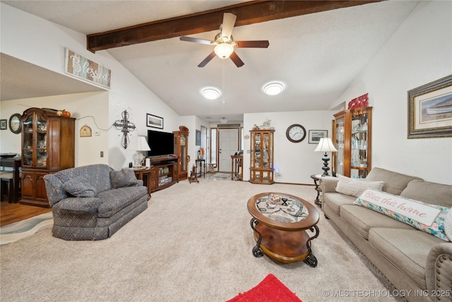 living room with lofted ceiling with beams, carpet floors, and ceiling fan