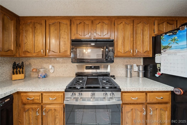 kitchen featuring brown cabinetry, decorative backsplash, a textured ceiling, and black appliances