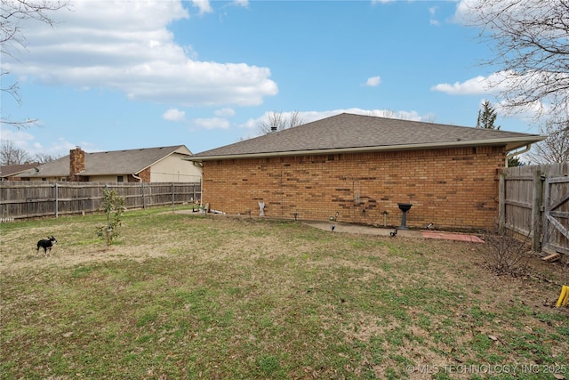 view of yard with a fenced backyard