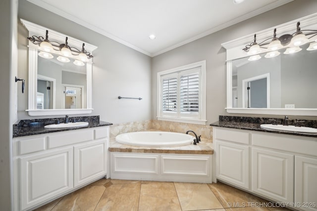 full bathroom with ornamental molding, two vanities, a sink, and a bath