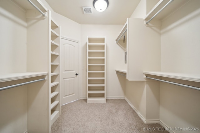 spacious closet featuring carpet and visible vents