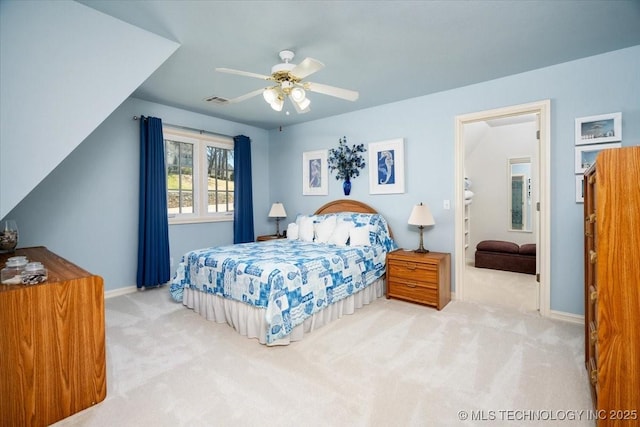 bedroom with carpet flooring, ceiling fan, visible vents, and baseboards