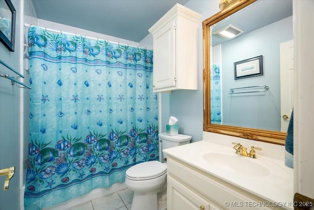 bathroom featuring toilet, vanity, visible vents, and tile patterned floors