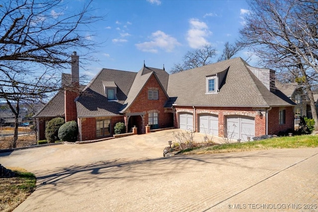 view of front of house featuring driveway, roof with shingles, and brick siding