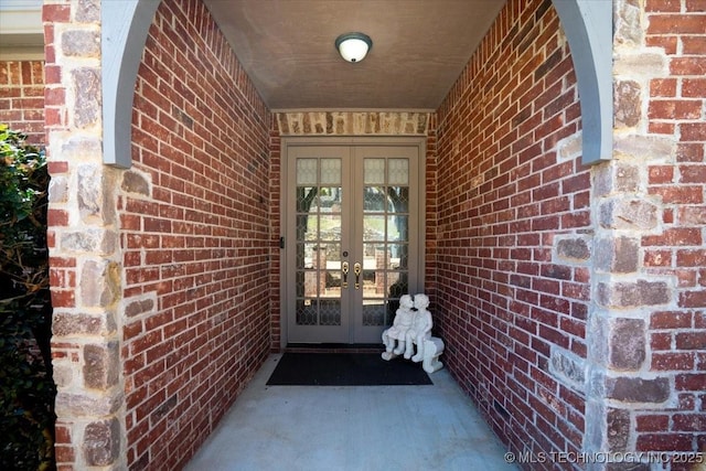 entrance to property with french doors and brick siding