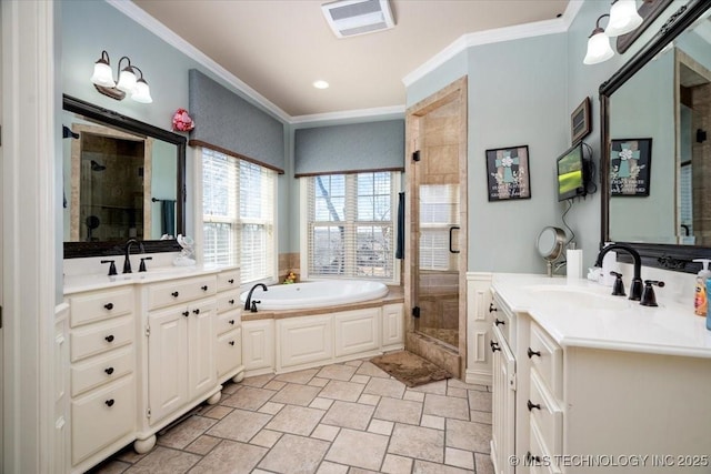 bathroom with crown molding, a stall shower, and a sink