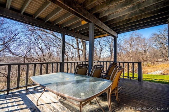 deck with outdoor dining area