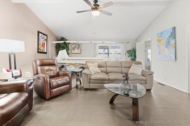 living area with visible vents, a ceiling fan, light tile patterned flooring, and vaulted ceiling