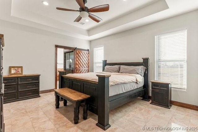 bedroom with baseboards, a tray ceiling, a ceiling fan, and recessed lighting