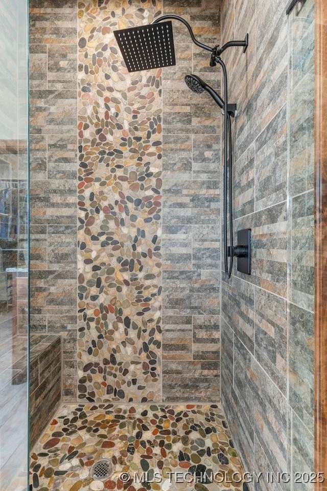 bathroom with tiled shower