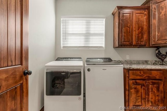 washroom with independent washer and dryer and cabinet space