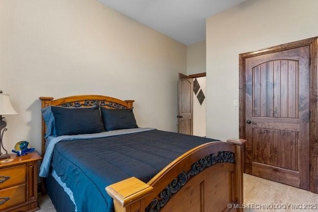 bedroom with light colored carpet