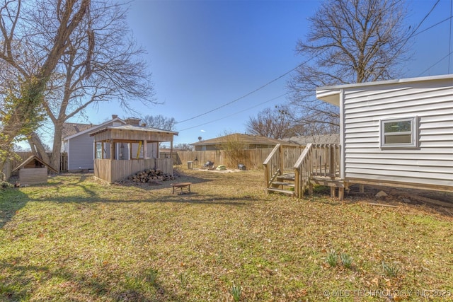 view of yard with an outbuilding and fence