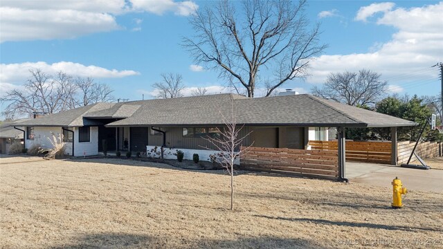 2808 E 37th Pl, Tulsa, OK 74105 - ranch-style home featuring covered porch, concrete driveway, roof with shingles, and a chimney
