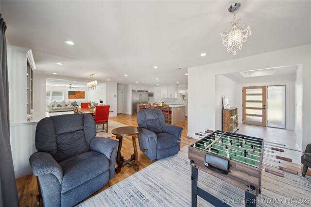 2808 E 37th Pl, Tulsa, OK 74105 - game room featuring a chandelier, light wood finished floors, and recessed lighting