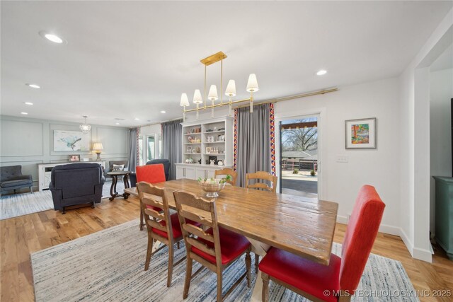 2808 E 37th Pl, Tulsa, OK 74105 - dining space featuring wood finished floors, recessed lighting, and a chandelier