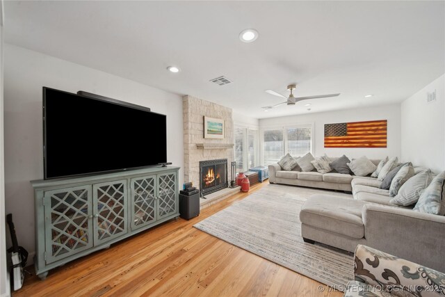 2808 E 37th Pl, Tulsa, OK 74105 - living area with ceiling fan, wood finished floors, a stone fireplace, and recessed lighting