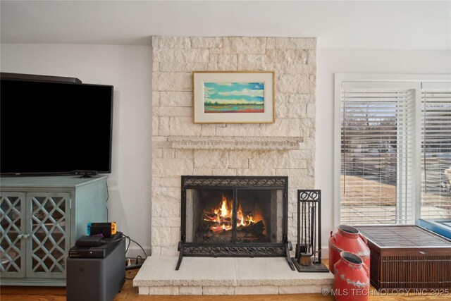 2808 E 37th Pl, Tulsa, OK 74105 - detailed view of a lit fireplace and wood finished floors