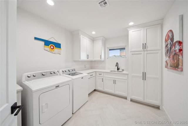 2808 E 37th Pl, Tulsa, OK 74105 - laundry room featuring independent washer and dryer, cabinet space, and recessed lighting