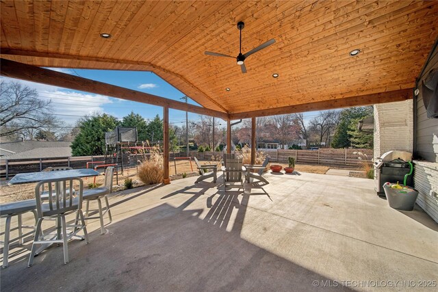2808 E 37th Pl, Tulsa, OK 74105 - fenced backyard featuring outdoor dining space, a patio, ceiling fan, and area for grilling