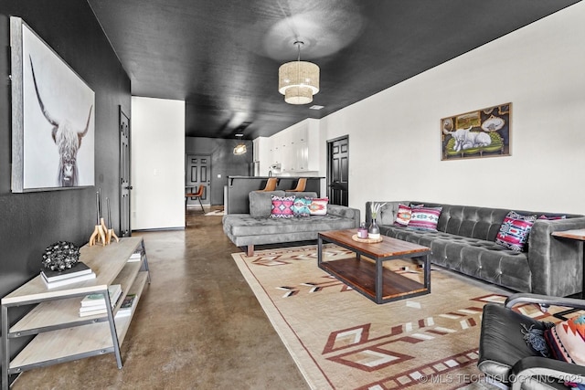 living area featuring finished concrete floors