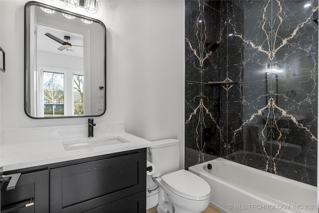 bathroom featuring shower / bath combination, vanity, and toilet