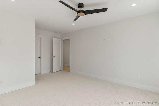 empty room with carpet floors, ceiling fan, baseboards, and recessed lighting