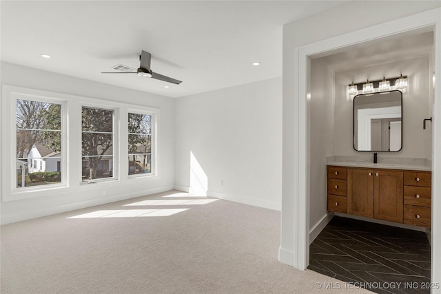 interior space featuring baseboards, visible vents, ceiling fan, vanity, and recessed lighting