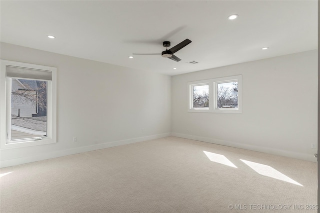 carpeted empty room with recessed lighting, visible vents, ceiling fan, and baseboards