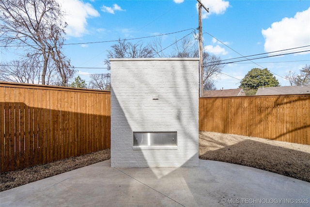 view of outbuilding featuring a fenced backyard