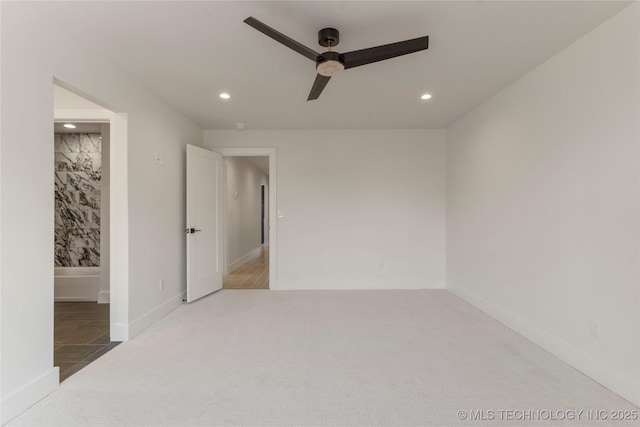 unfurnished room with recessed lighting, carpet flooring, ceiling fan, and baseboards