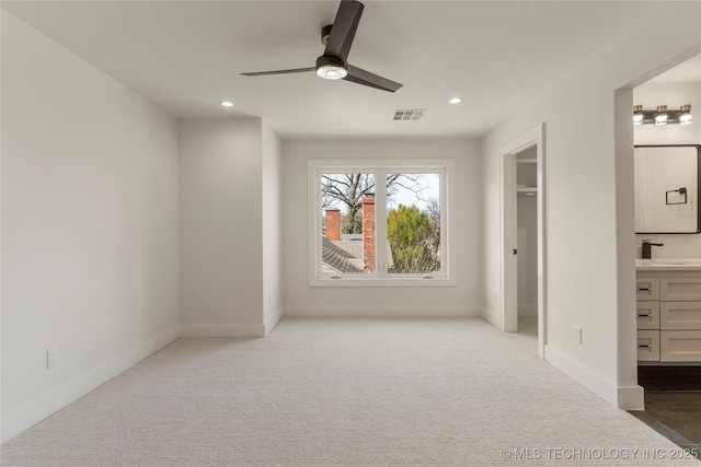 unfurnished bedroom with carpet, visible vents, baseboards, and recessed lighting