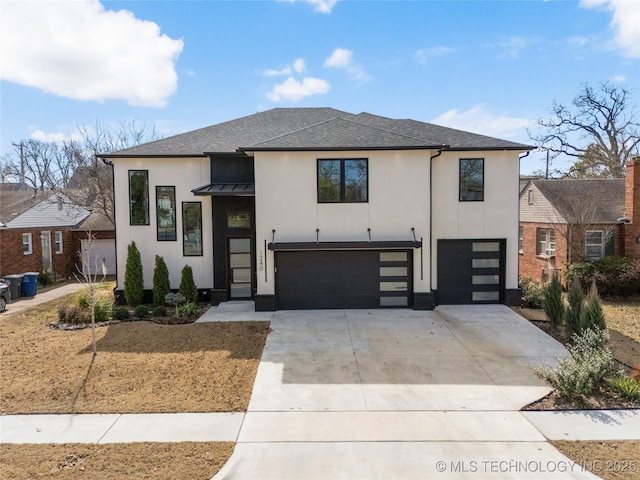 modern home featuring a shingled roof, concrete driveway, an attached garage, a standing seam roof, and metal roof